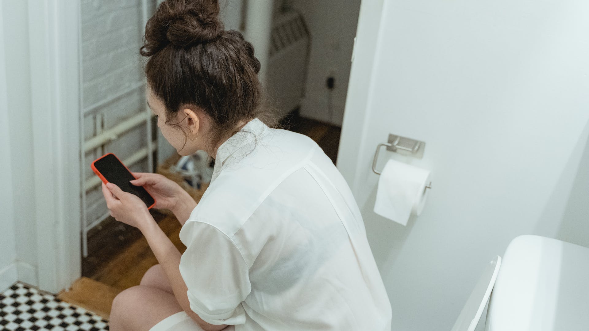 lady sitting on the toilet